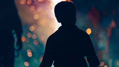 Boy at a bonfire