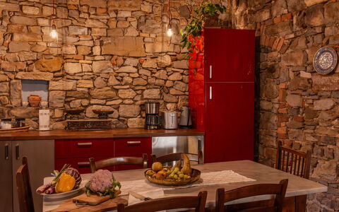 Casa Di Vignolo: Wall, Furniture, Interior Design, Flooring, Kitchen, Stone Wall, Room, Cabinetry, Ceiling, Countertop