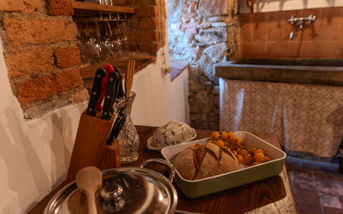 Casa Di Vignolo: Furniture, Interior Design, Food, Room, Countertop, Wood Stain, Kitchen & Dining Room Table, Light Fixture, Chair, Serveware