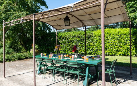 La Forra: Table, Plant, Furniture, Shade, Outdoor Furniture, Tree, Outdoor Table, Chair, Grass, Leisure