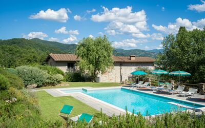 Podere Schignano: Plant, Cloud, Water, Sky, Furniture, Building, Swimming Pool, Green, Tree, Architecture