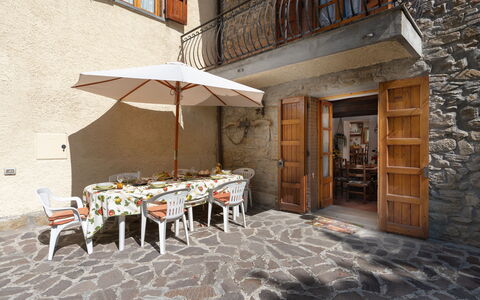 Casa Corella: Furniture, Building, Table, Window, Umbrella, Chair, Outdoor Table, Outdoor Furniture, Flowerpot, Shade