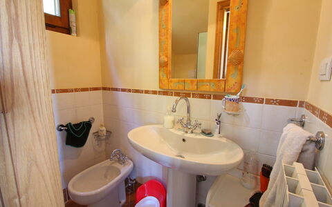 Villa La Collinetta: Mirror, Brown, Tap, Sink, Plumbing Fixture, Bathroom Sink, Property, Bathroom, Purple, Interior Design