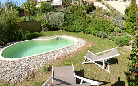 Al Colle Di Lari: Property, Swimming Pool, Backyard, Grass, Yard, House, Residential Area, Real Estate, Landscaping, Leisure