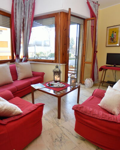 Carnevale: Living Room, Furniture, Room, Property, Interior Design, Building, Couch, Real Estate, Curtain, House