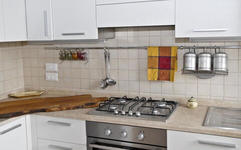 Villa Eleonora: Countertop, Cabinetry, Kitchen, Room, Furniture, Property, Tile, Drawer, Kitchen Stove, Interior Design