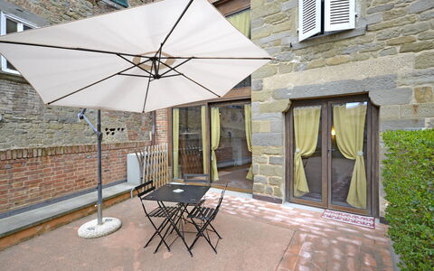 Appartamento Passerini: Umbrella, Property, Home, Real Estate, House, Roof, Shade, Building, Patio, Furniture