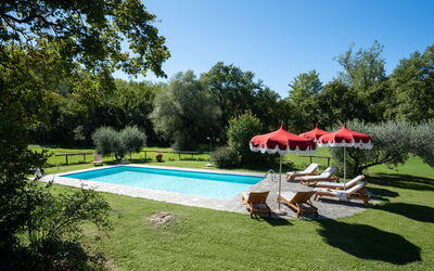 Villa Marina: Plant, Water, Sky, Swimming Pool, Shade, Umbrella, Tree, Building, Outdoor Furniture, Chair