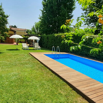 La Capannella: Plant, Shade, Tree, Sky, Swimming Pool, Building, Outdoor Furniture, Water, Real Estate, Flooring