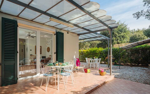 Marina Pietrasanta 255: Plant, Building, Furniture, Table, Sky, Shade, Chair, Outdoor Furniture, Cloud, House