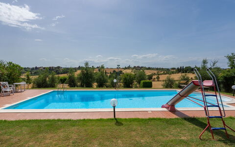 San Piero: Sky, Water, Plant, Cloud, Swimming Pool, Tree, Shade, Rectangle, Grass, Outdoor Furniture