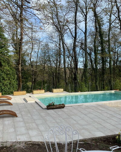 Villa La Casa Bianca: Property, Plant, Sky, Tree, Swimming Pool, Outdoor Furniture, Shade, Interior Design, Grass, Real Estate