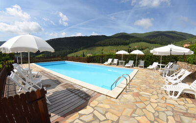 Podere Di Mero Casolare: Sky, Cloud, Water, Building, Swimming Pool, Sunlounger, Outdoor Furniture, Umbrella, Shade, Chair