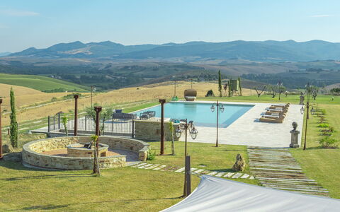 Villa Massimiliano: Sky, Mountain, Water, Cloud, Shade, Land Lot, Grass, Swimming Pool, Natural Landscape, Plant