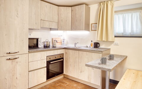 Portovecchio Apartments - Levanto: Wood, Interior Design, Furniture, Cabinetry, Kitchen, Home, Countertop, Kitchen Appliance, Major Appliance, Room