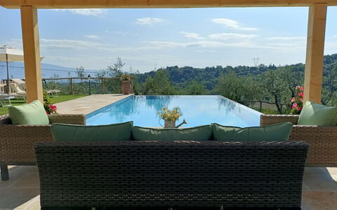 Villa Claudia: Sky, Plant, Cloud, Property, Furniture, Azure, Building, Shade, Outdoor Furniture, Rectangle