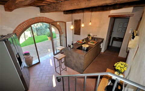 Villa Claudia: Table, Plant, Houseplant, Building, Interior Design, Floor, Chair, Couch, Living Room, Wood