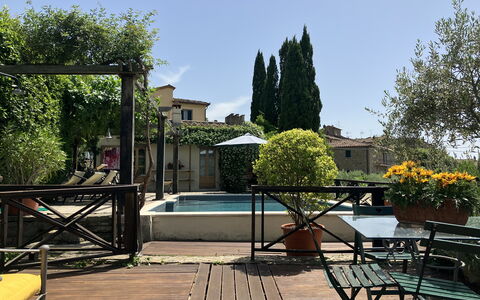 Villa Toppani Del Sodo: Sky, Table, Building, Plant, Shade, Tree, Outdoor Furniture, Chair, Flowerpot, Leisure