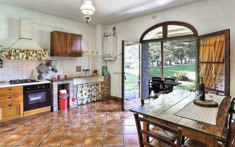 Agriturismo Le Selvole: Cabinetry, Furniture, Property, Countertop, Table, Window, Chair, Wood, Kitchen, Interior Design