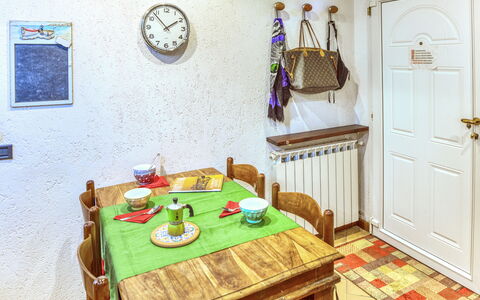 Mario - Levanto: Wood, Room, Interior Design, Door, Table, Flooring, Floor, Dining Room, Wall, Wood Stain