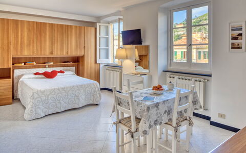 Studio Paola - Levanto: Furniture, Property, Table, Window, Cabinetry, Wood, Interior Design, Comfort, Floor, Flooring