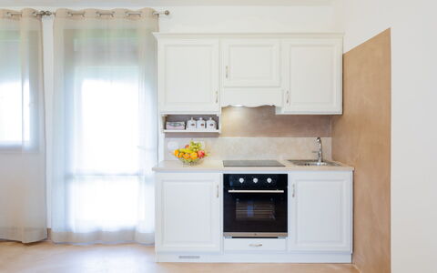 Villa Papiano: Cabinetry, Countertop, Property, Building, Kitchen Stove, Kitchen, Wood, Window, Kitchen Appliance, Home Appliance