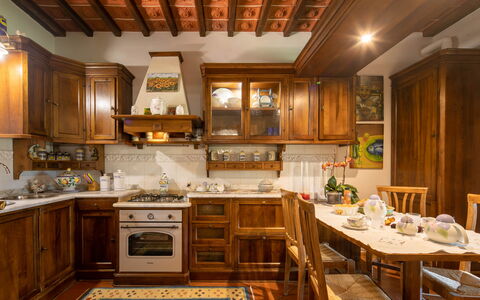 Valdambra Villa: Furniture, Interior Design, Cabinetry, Wood, Kitchen, Flooring, Cupboard, Countertop, Ceiling, Room