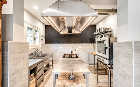 Villa Alfresco: Cabinetry, Furniture, Table, Countertop, Chair, Building, Kitchen, Hall, Wood, Couch