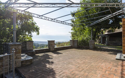 Villa Montignoso: Sky, Cloud, Daytime, Property, Plant, Shade, Road Surface, Residential Area, Grass, Tree