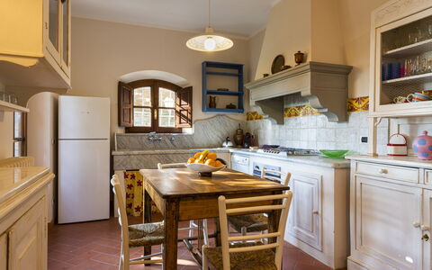 Villa Montignoso: Cabinetry, Countertop, Property, Furniture, Kitchen Appliance, Kitchen Stove, Wood, Kitchen, Interior Design, Table