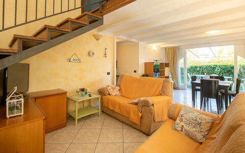 Villa Isola: Furniture, Property, Table, Comfort, Couch, Building, Orange, Wood, Interior Design, Floor