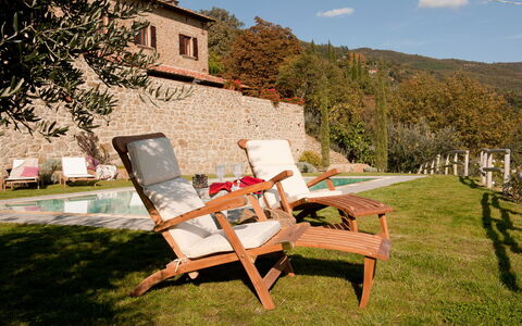 Villa Adelfa: Plant, Sky, Cloud, Outdoor Furniture, Chair, Building, Tree, Armrest, Grass, Leisure