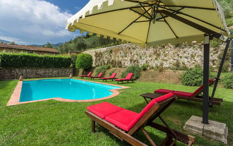 Villa Cantignano: Plant, Building, Umbrella, Water, Cloud, Nature, Tree, Shade, Outdoor Furniture, Swimming Pool