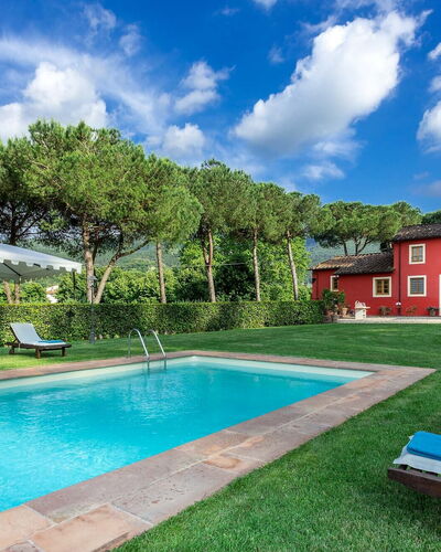 Villa Guamo: Cloud, Plant, Water, Property, Building, Sky, Swimming Pool, Tree, Azure, Outdoor Bench
