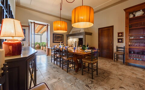 Villa Agnola: Table, Property, Furniture, Wood, Lighting, Chair, Interior Design, Kitchen, Floor, Lamp