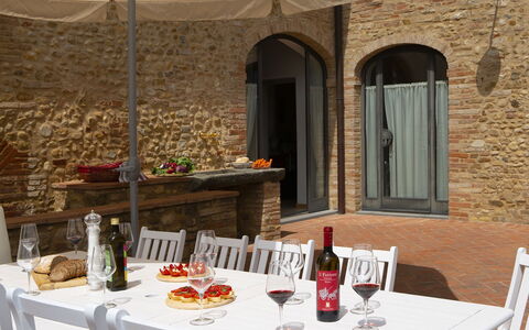 Villa Pianora: Table, Food, Tableware, Bottle, Furniture, Window, Interior Design, Plate, Tablecloth, Drinkware