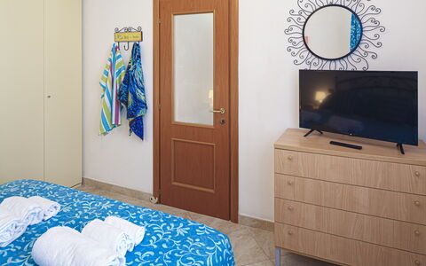Apartments Mafalda - Levanto: Property, Furniture, Cabinetry, Blue, Interior Design, Mirror, Comfort, Wood, Building, Floor