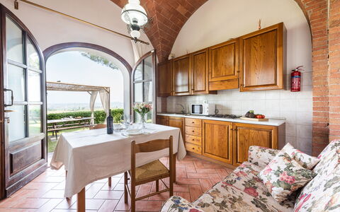 Villa Varna: Table, Furniture, Cabinetry, Property, Chair, Countertop, Wood, Window, Drawer, Kitchen