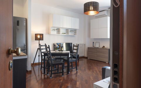 Novoli Suite Apartment: Table, Furniture, Property, Picture Frame, Couch, Lighting, Chair, Wood, Houseplant, Interior Design