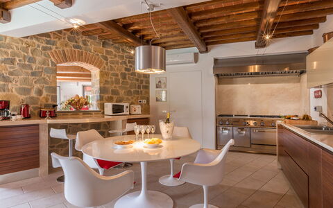 Villa Vico: Table, Countertop, Furniture, Property, Cabinetry, Chair, Kitchen, Wood, Lighting, Interior Design