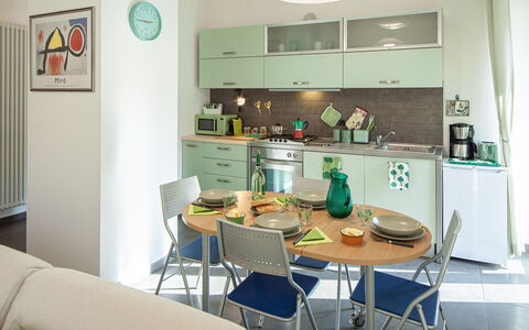 Apartment Serena - Levanto: Property, Furniture, Table, Chair, Cabinetry, Lighting, Interior Design, Shelf, Houseplant, Real Estate