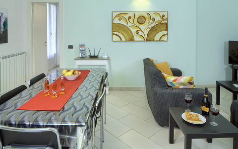 Apartment Fernanda 2 - Levanto: Table, Furniture, Property, Picture Frame, Building, Textile, Interior Design, Chair, Floor, Flooring