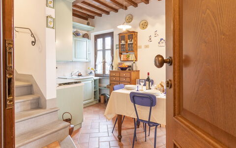 Il Borgo Apartment: Table, Furniture, Cabinetry, Wood, Interior Design, Countertop, Chair, Door, Floor, Kitchen