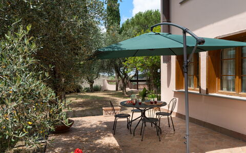 Villa Morellino: Plant, Furniture, Table, Building, Chair, Tree, Umbrella, Shade, Outdoor Furniture, Outdoor Table