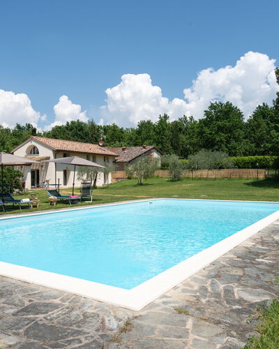 Villa Le Selve: Cloud, Water, Sky, Plant, Property, Swimming Pool, Shade, Tree, Building, Grass