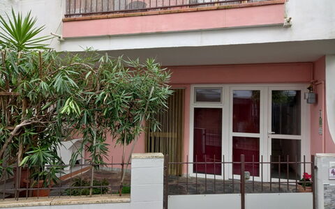 La Butterfly: Door, Residential Area, Home, Balcony, Concrete, Home Door, Porch, Plaster, Houseplant, Fence