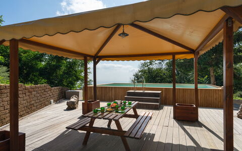 Casa Serra: Furniture, Property, Table, Plant, Building, Shade, Wood, Outdoor Furniture, Cloud, Tree