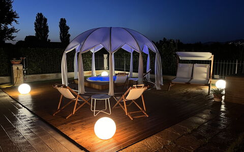 Villa Castelnuovo: Sky, Furniture, Building, Light, Table, Lighting, Outdoor Furniture, Shade, Chair, Tent