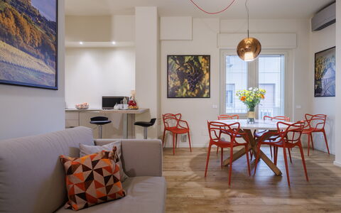 Betty Florence Charming Modern Apartment Near Piaz: Table, Picture Frame, Furniture, Property, Window, Couch, Wood, Interior Design, Orange, Flooring