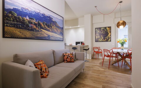 Betty Florence Charming Modern Apartment Near Piaz: Picture Frame, Furniture, Property, Couch, Table, Orange, Interior Design, Plant, Comfort, Living Room